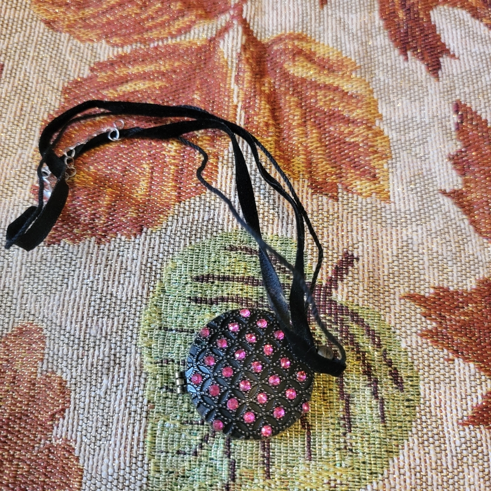 Necklace with hidden compartment